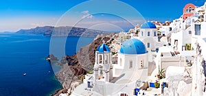 Panoramic scenic view of beautiful white houses on Santorini