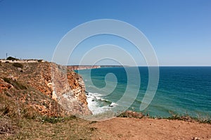 Panoramic sea view from a sandy mountain cliff, Cape Kaliakra Bulgaria, sea horizon, bright sunny seascape, blue sky and turquoise