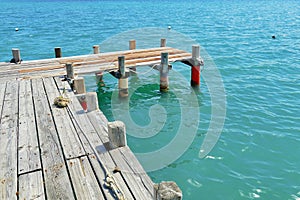 panoramic seascape view with deserted rustic wooden pier