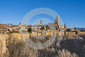 Panoramic of Segovia and its walls with moon. Spain