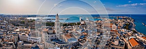 Panoramic shot of the Bari Cathedral surrounded by buildings and sea in Italy photo