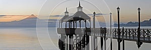 Panoramic shot of the beautiful pier located in Frutillar, Chile during sunset