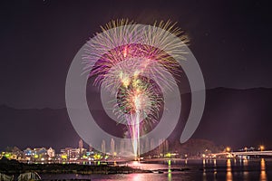 Panoramic shot of a city with a beautiful fireworks display