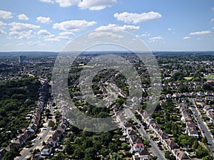 Panoramic shot of a cityscape with orderly streets and greenery