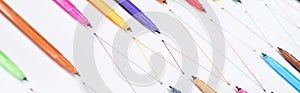 Panoramic shot of colorful felt-tip pens on white background with connected drawn lines, connection and communication