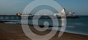 Panoramic shot of the Eastbourne pier with white luxurious temples in the evening
