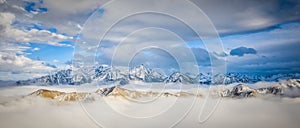 Panoramic shot of the Gongga Mountain covered in the snow in Kangding, China