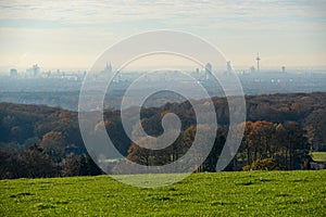 Panoramic shot at the hazy Cologne Skyline from an elevated standpoint in Rheingraben, Rhine valley