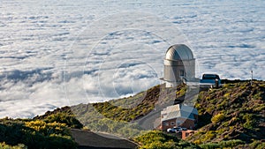 Panoramic shot of the La Palma astronomical observatory on the sea of clouds background
