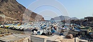 Panoramic shot of an overcrowded coastline by fishing boats captured in the fishing bay Aden