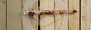 Panoramic shot of a rusty metallic old lock of a wooden door in Toten, Norway