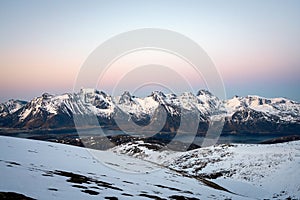 Panoramic shot from Ryten overlooking the snowy peaks in ramberg/lofoten/norway.