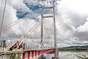 Panoramic shot of the structure of a large bridge with tension cables in the green gulf of Costa Rica in Guanacaste