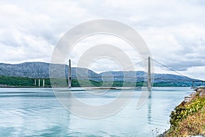 Panoramic sideview photo of Helgelandsbrua norwegian or Helgeland Bridge is Norway`s finest bridges between Alstahaug and photo