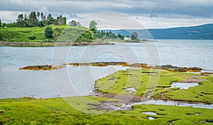 Panoramic sight in the Isle of Mull with Aros Castle in background, Scotland. photo