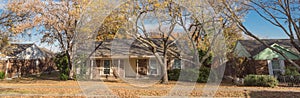 Panoramic single story bungalow houses in suburbs of Dallas with bright fall foliage colors