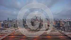 Panoramic skyline of Dubai with business bay and downtown district night to day .