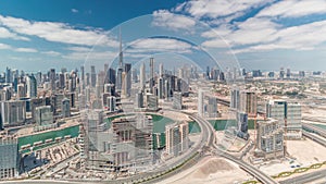 Panoramic skyline of Dubai with business bay and downtown district timelapse.