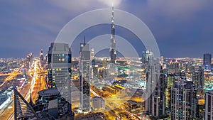 Panoramic skyline of Dubai day to night timelapse, United Arab Emirates. View of world famous skyscrapers.