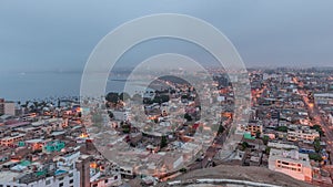 Panoramic skyline of Lima city from above with many buildings aerial night to day transition timelapse. Lima, Peru