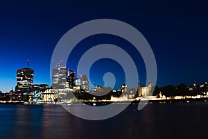 Panoramic skyline view of Bank and Canary Wharf, central London`s leading financial districts with famous skyscrapers at golden h