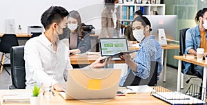 Panoramic Social distance office with business team wear face mask as new normal life