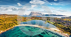 Panoramic spring view from flying drone of Salina Bamba beach with Tavolara mountain