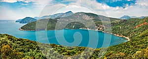 Panoramic summer view of azure water bay, near Parga town. Green morning seascape of Ionian Sea. Beautiful outdoor scene of Greece