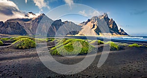 Panoramic summer view of Stokksnes cape with Vestrahorn Batman Mountain on background.