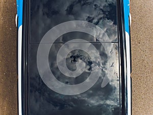 Panoramic sunroof in a car Automotive closeup. drone reflection