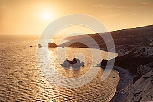 Panoramic sunset landscape of Petra tou Romiou (The rock of the Greek), Aphrodite& 39;s legendary birthplace in Paphos, Cyprus photo