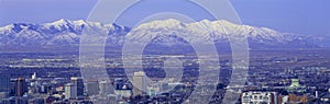 Panoramic sunset of Salt Lake City with snow capped Wasatch Mountains