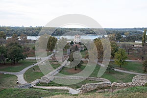 Panoramic sunset view of Belgrade Fortress, Kalemegdan Park, Sava and Danube Rivers in city.