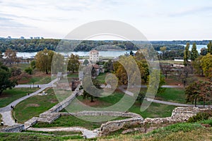 Panoramic sunset view of Belgrade Fortress, Kalemegdan Park, Sava and Danube Rivers in city.