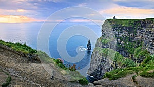 Panoramic sunset view of the Cliffs of Moher with sea stack, Ireland