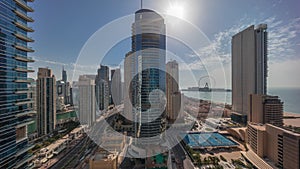 Panoramic sunset view of the Dubai Marina and JBR area and the famous Ferris Wheel aerial timelapse