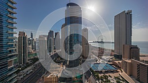 Panoramic sunset view of the Dubai Marina and JBR area and the famous Ferris Wheel aerial timelapse