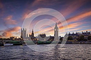 Panoramic sunset view of the illuminated Westminster Bridge and Palace in London