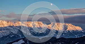 Panoramic sunset view moon Saalbach skiing Mountain moonrise dark mood