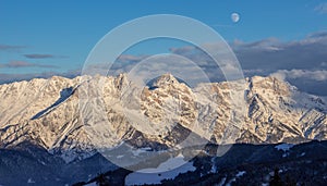 Panoramic sunset view moon Saalbach skiing Mountain moonrise dark mood