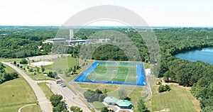 Panoramic top view aerial view of soccer green grass field in public park