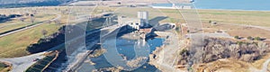 Panoramic top view electrical substation, powerhouse with hydroelectric turbines over Denison Dam