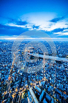 Panoramic urban city skyline aerial view under twilight sky and neon night in tokyo, Japan