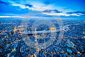 Panoramic urban city skyline aerial view under twilight sky and neon night in tokyo, Japan