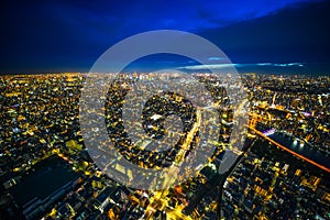 Panoramic urban city skyline aerial view under twilight sky and neon night in tokyo, Japan