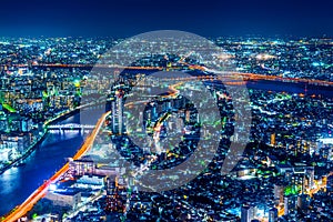 Panoramic urban city skyline aerial view under twilight sky and neon night in tokyo, Japan