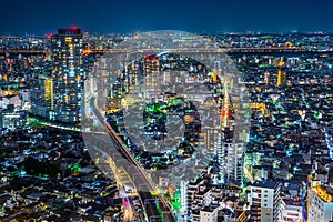 Panoramic urban city skyline aerial view under twilight sky and neon night in tokyo, Japan