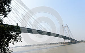 Panoramic Vidyasagar Setu or Hooghly Bridge during sunset. Famous longest cable stayed toll flyover over Ganges River connection