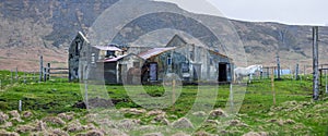 Panoramic view of abandoned farm house in Iceland countryside