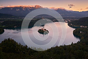 Panoramic view from above of the lake and the city of Bled in Slovenia at sunset.